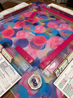 Bubble Dream Parade mahjong mat styled with pink mahjong tiles and clear racks