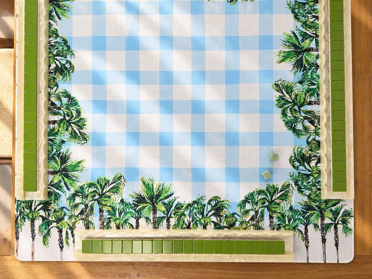 Blue gingham and palm tree mahjong mat with green tiles